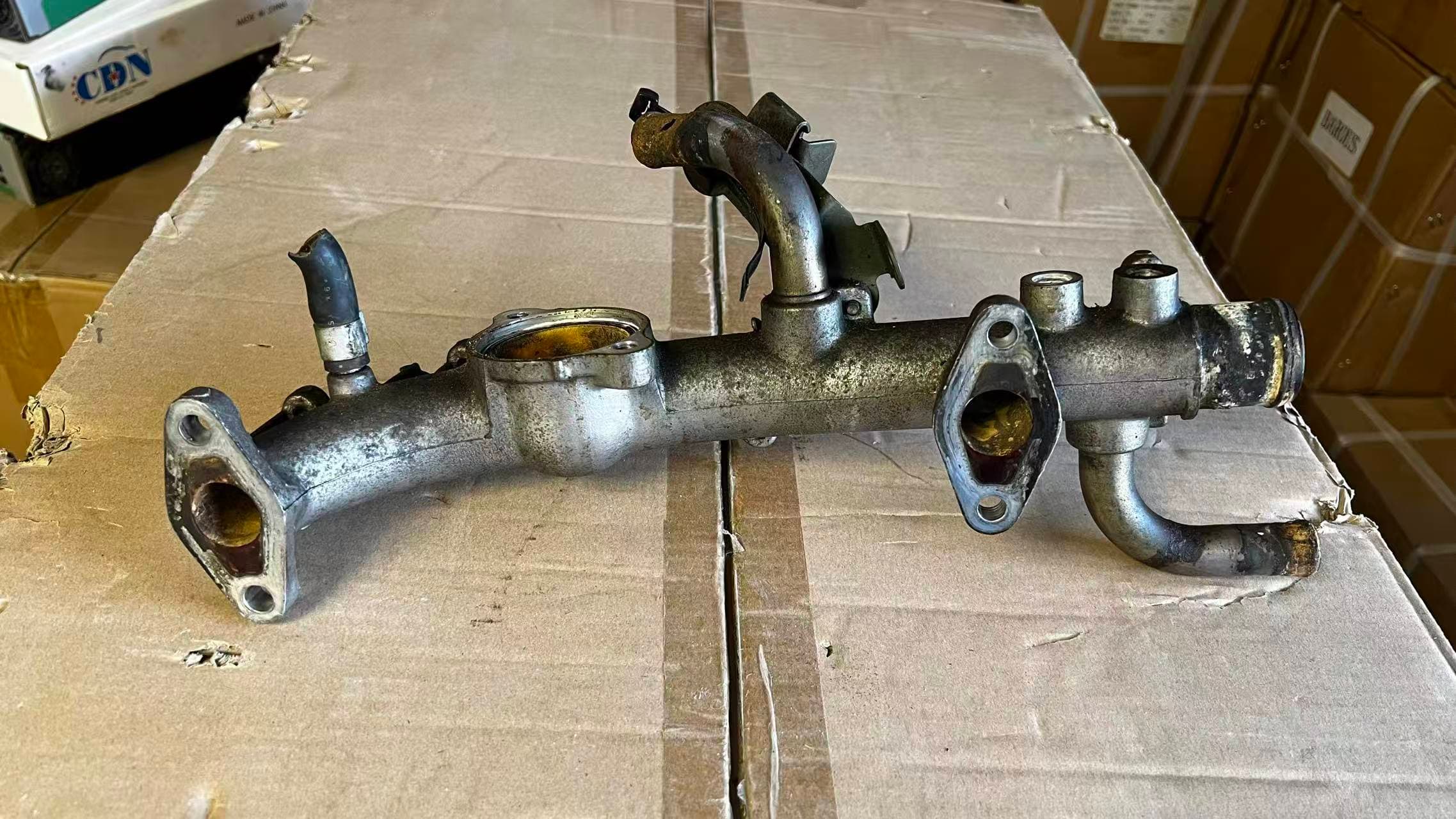 Nissan Maxima Water Outlet Housing (OE: 11060-2Y000) photo 1